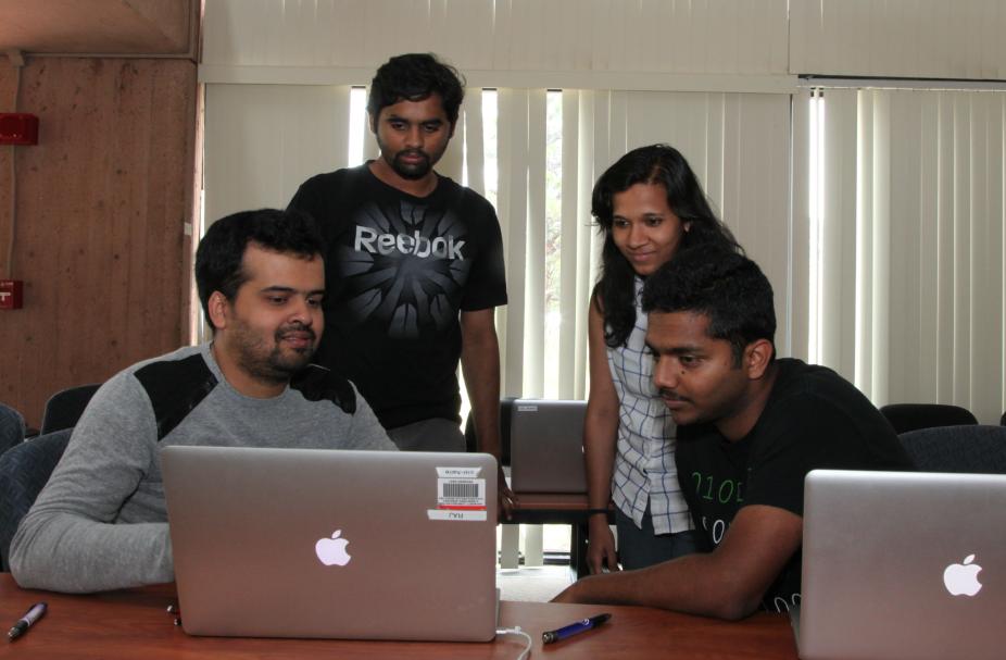 Students work on code at hackathon